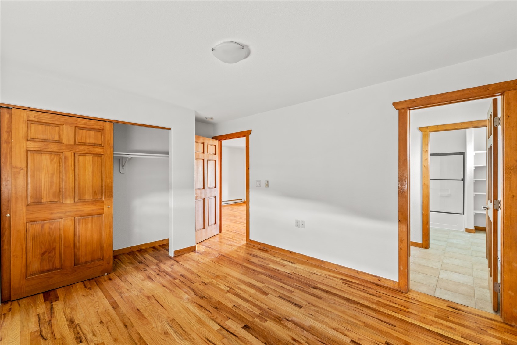 127 Oak Ridge Circle, Unit 104 Oak Creek, CO 80467 - Photo 17 of 26 a view of empty room with wooden floor and entryway