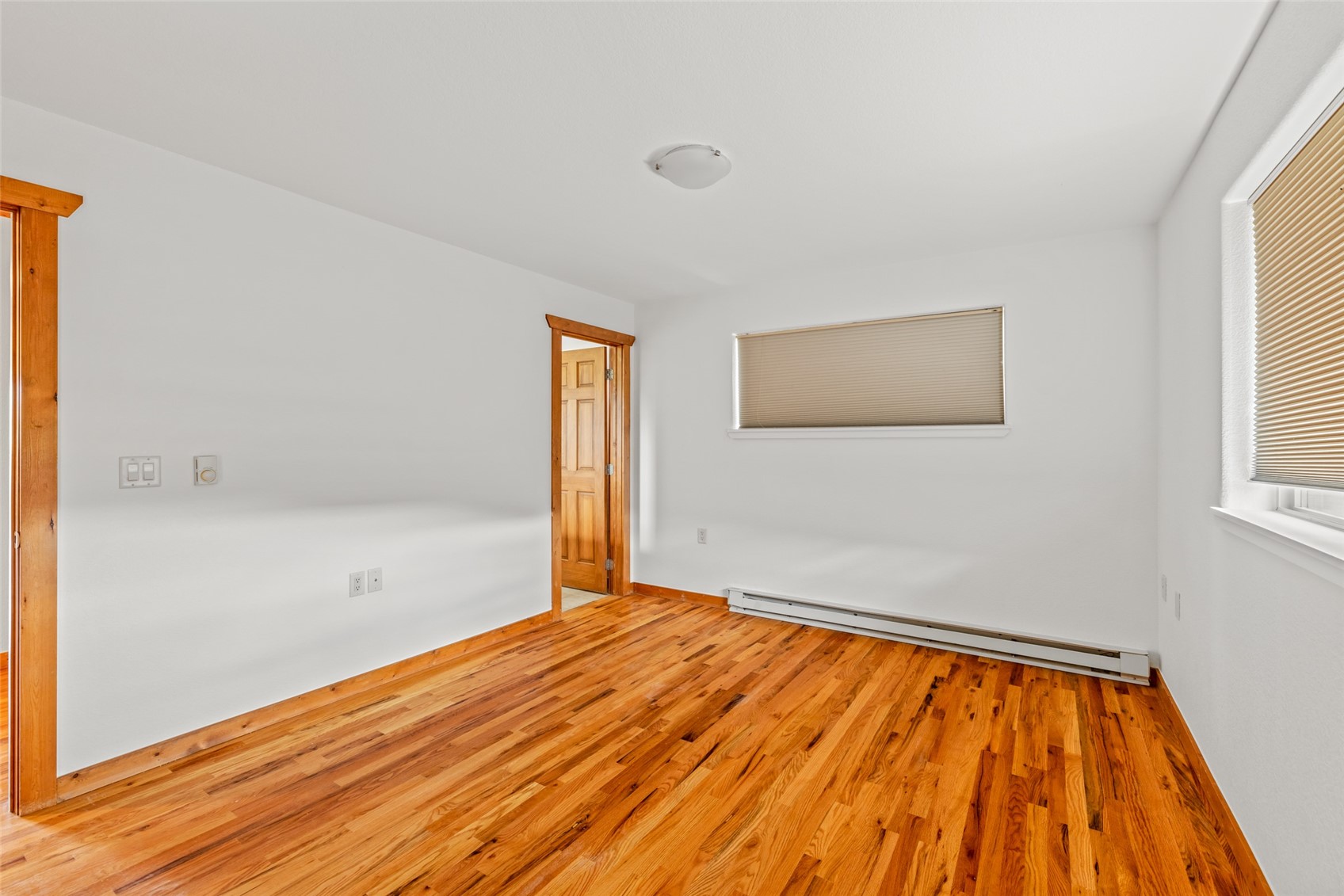 127 Oak Ridge Circle, Unit 104 Oak Creek, CO 80467 - Photo 18 of 26 a view of empty room with wooden floor and fan