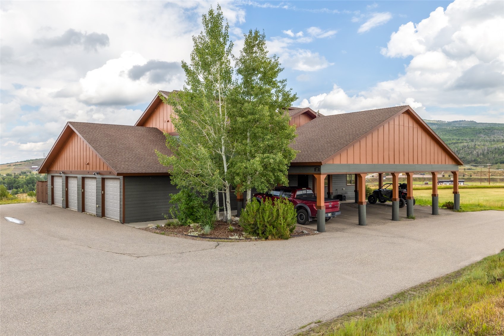 127 Oak Ridge Circle, Unit 104 Oak Creek, CO 80467 - Photo 2 of 26 front view of a house with a yard