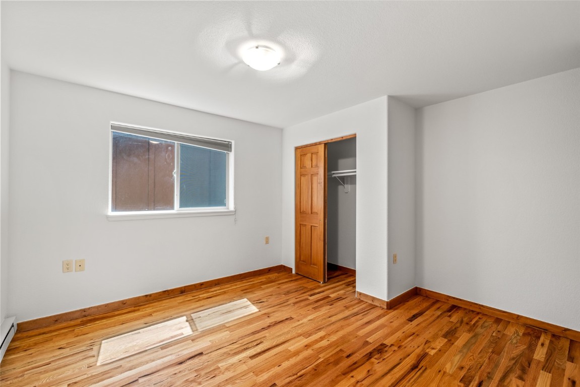 127 Oak Ridge Circle, Unit 104 Oak Creek, CO 80467 - Photo 21 of 26 a view of a room with wooden floor and closet