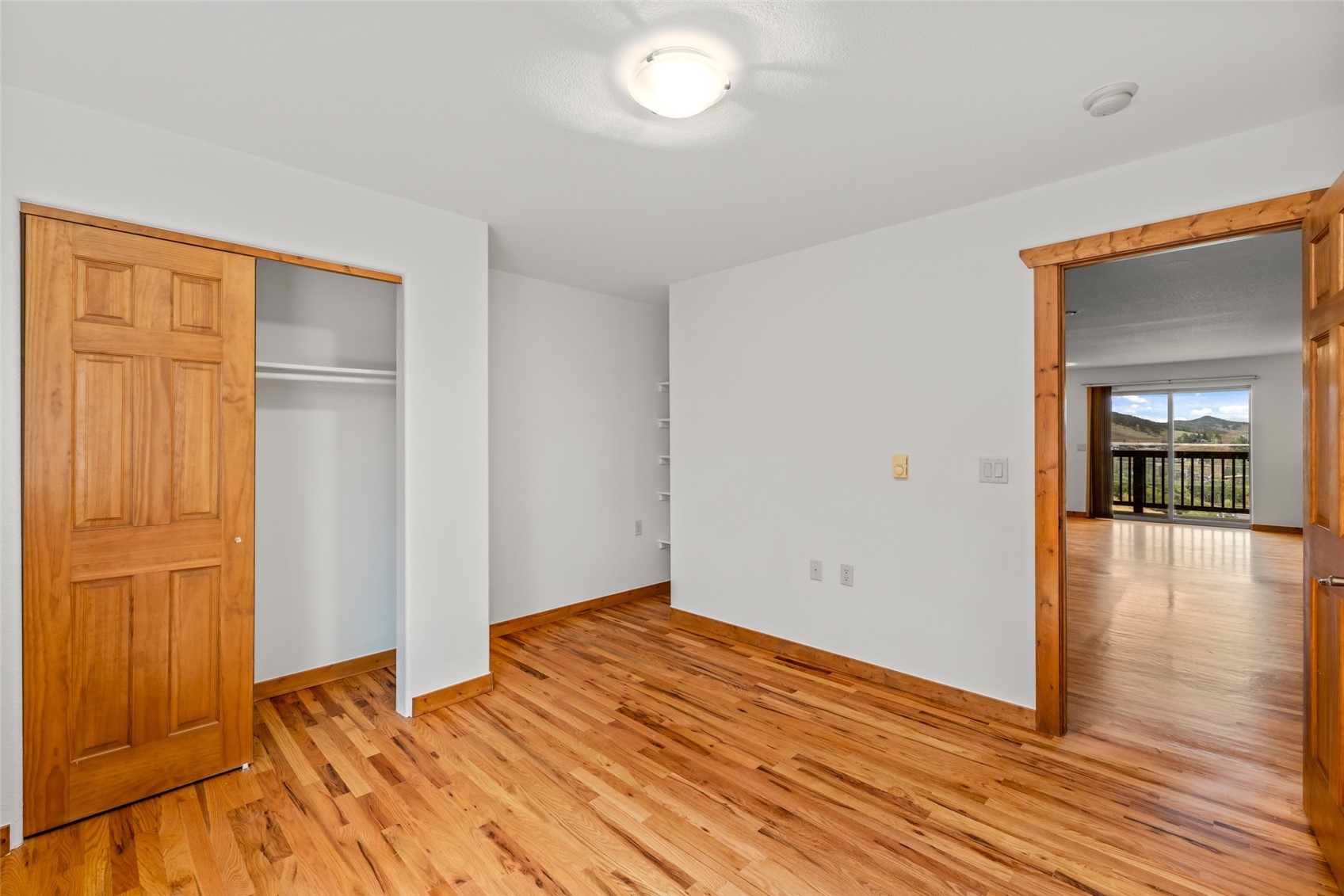 127 Oak Ridge Circle, Unit 104 Oak Creek, CO 80467 - Photo 22 of 26 a view of empty room with wooden floor and fan