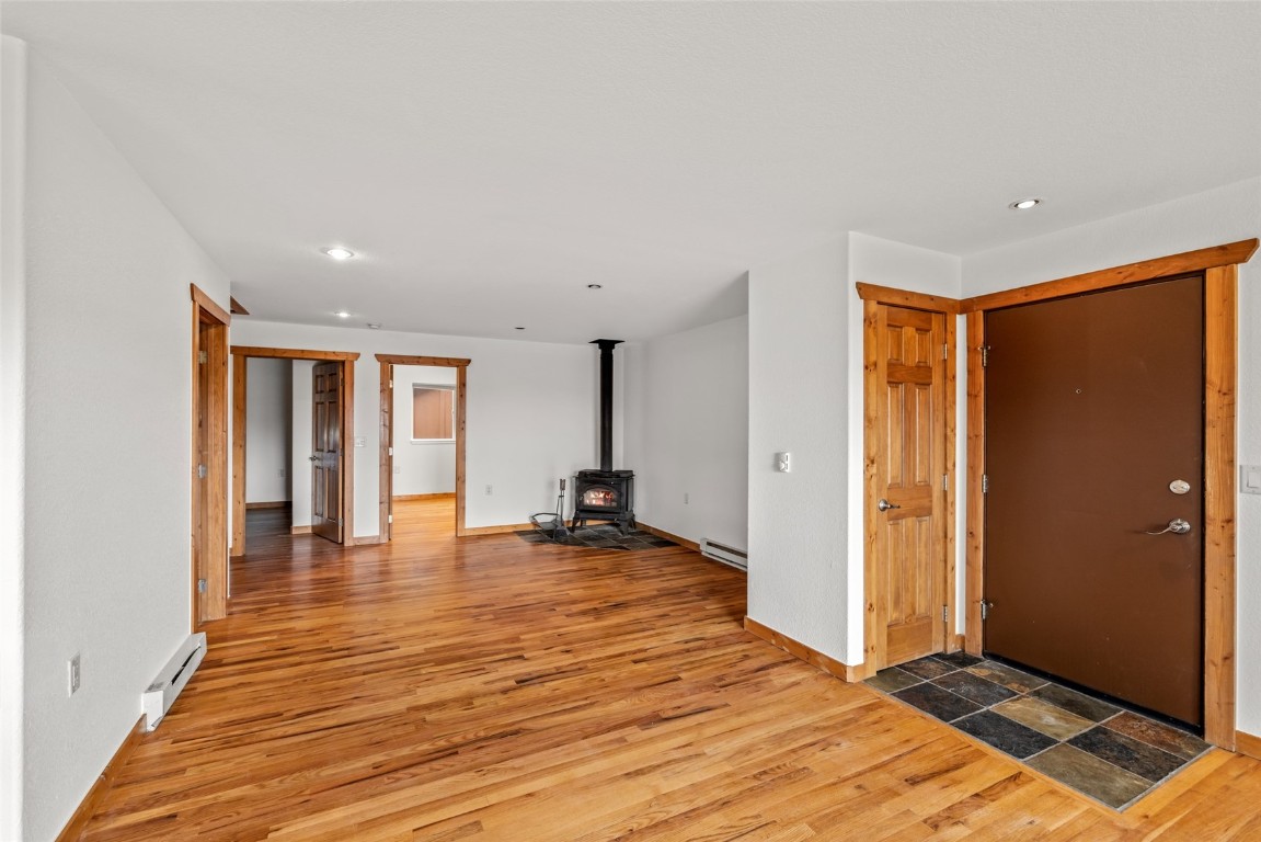 127 Oak Ridge Circle, Unit 104 Oak Creek, CO 80467 - Photo 6 of 26 a view of an empty room with window and wooden floor