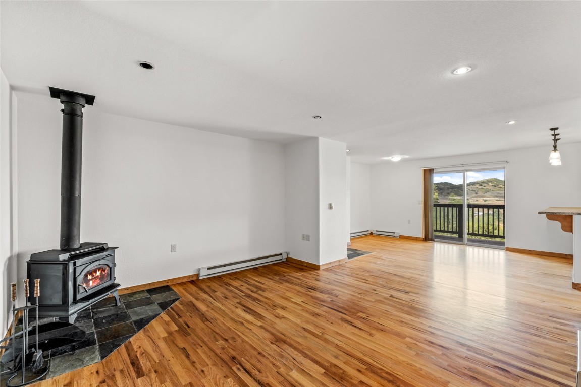 127 Oak Ridge Circle, Unit 104 Oak Creek, CO 80467 - Photo 10 of 26 a view of an empty room with wooden floor