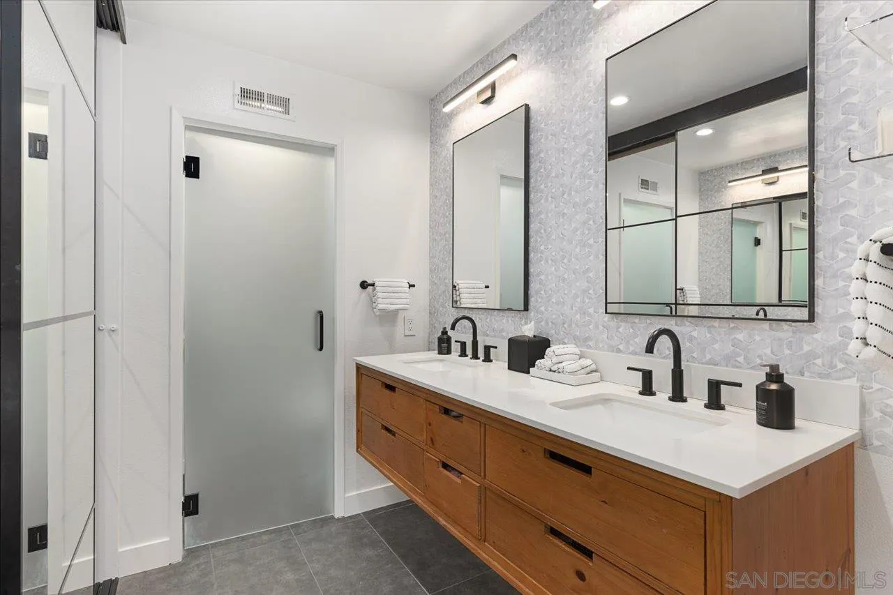 101 Rodney Avenue Encinitas, CA 92024 - Photo 14 of 31 a bathroom with double sink and two mirror