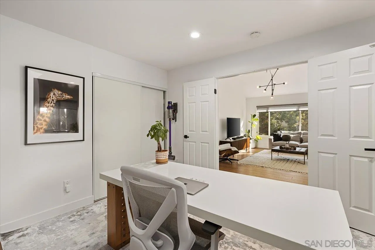 101 Rodney Avenue Encinitas, CA 92024 - Photo 22 of 31 a view of a room that has a couch and a dining table in it