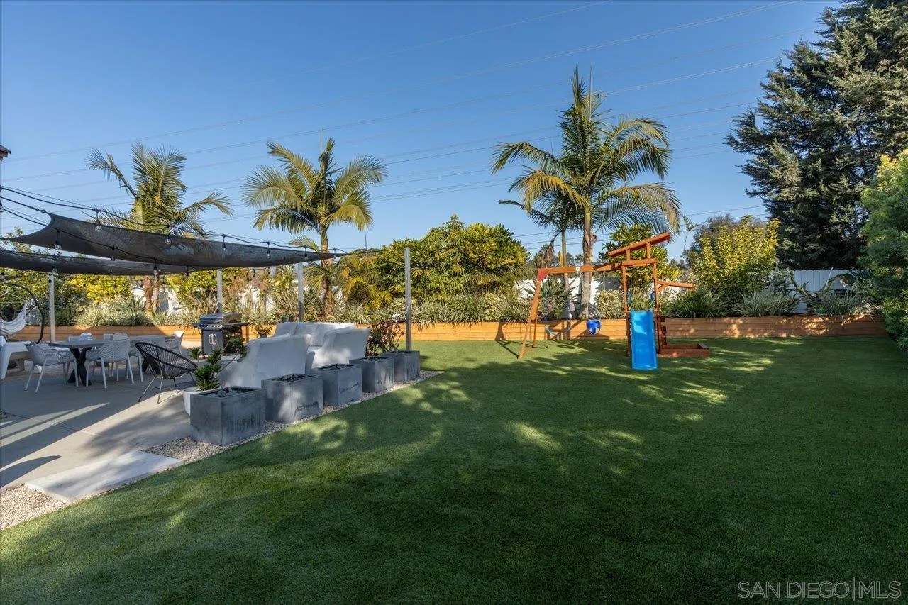 101 Rodney Avenue Encinitas, CA 92024 - Photo 23 of 31 a view of a yard with a table and chairs
