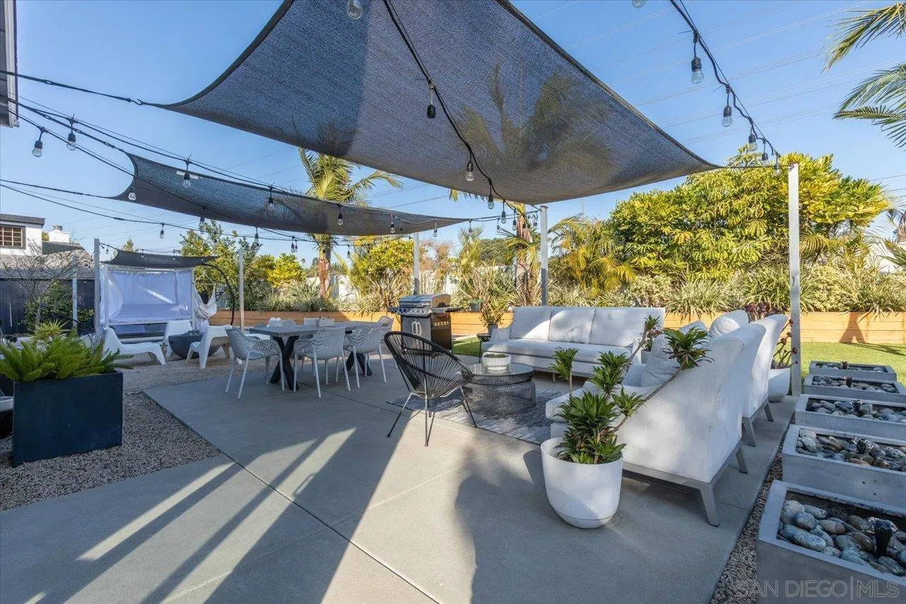 101 Rodney Avenue Encinitas, CA 92024 - Photo 25 of 31 a view of a patio filled with furniture and a potted plant