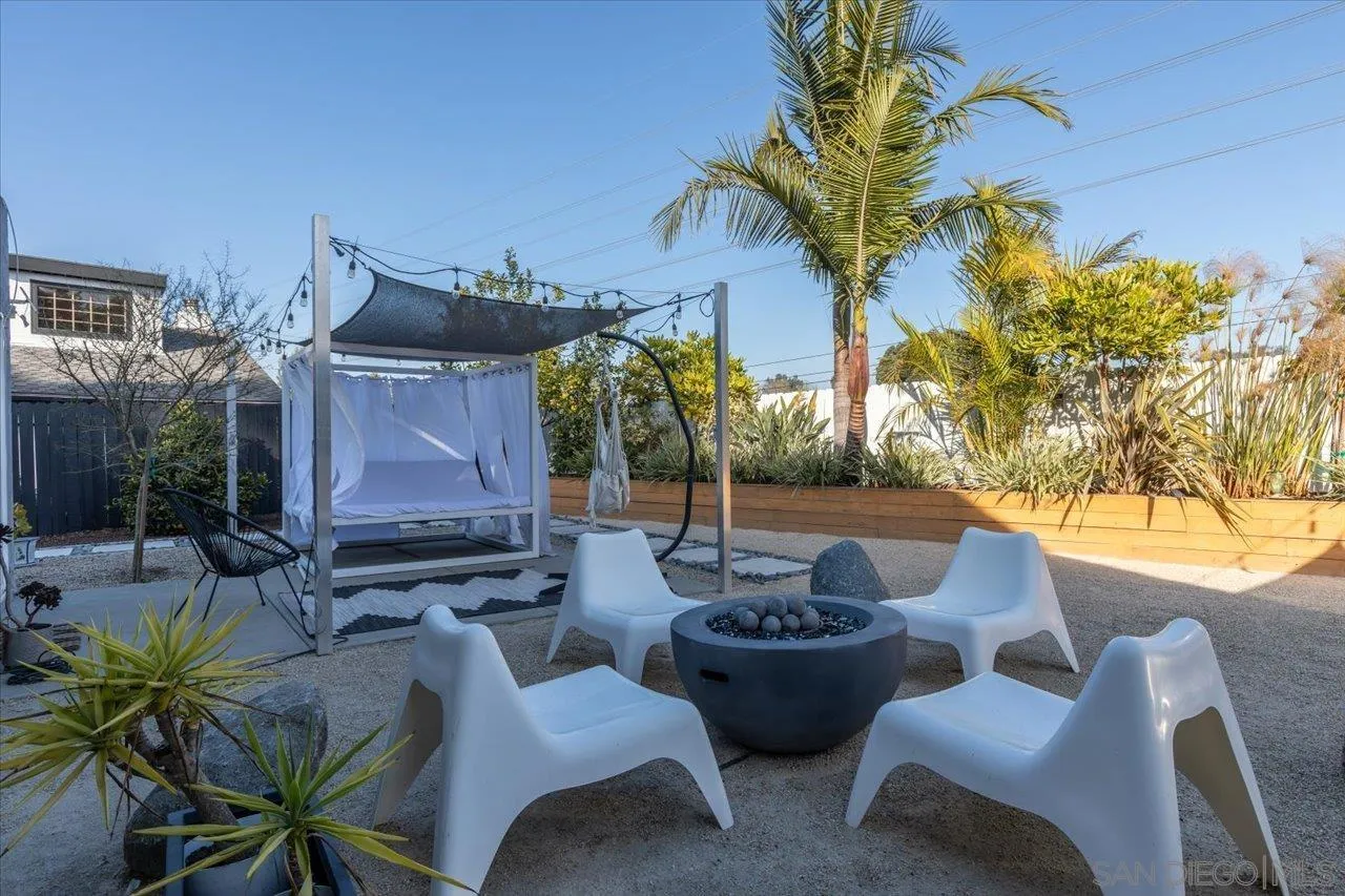 101 Rodney Avenue Encinitas, CA 92024 - Photo 27 of 31 a view of a patio with couches table and chairs and potted plants