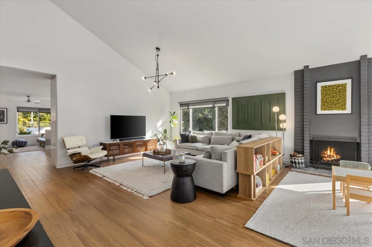 101 Rodney Avenue Encinitas, CA 92024 - Photo 4 of 31 a living room with furniture flat screen tv and a fireplace