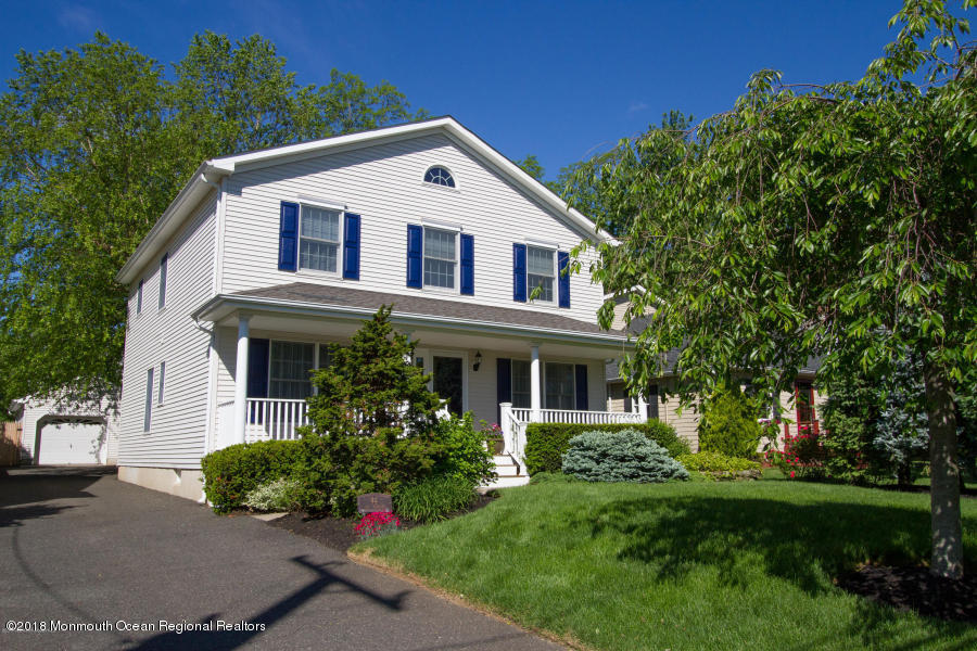 94 Ave Of Two Rivers Rumson, NJ 07760 - Photo 1 of 41 a front view of a house with a yard