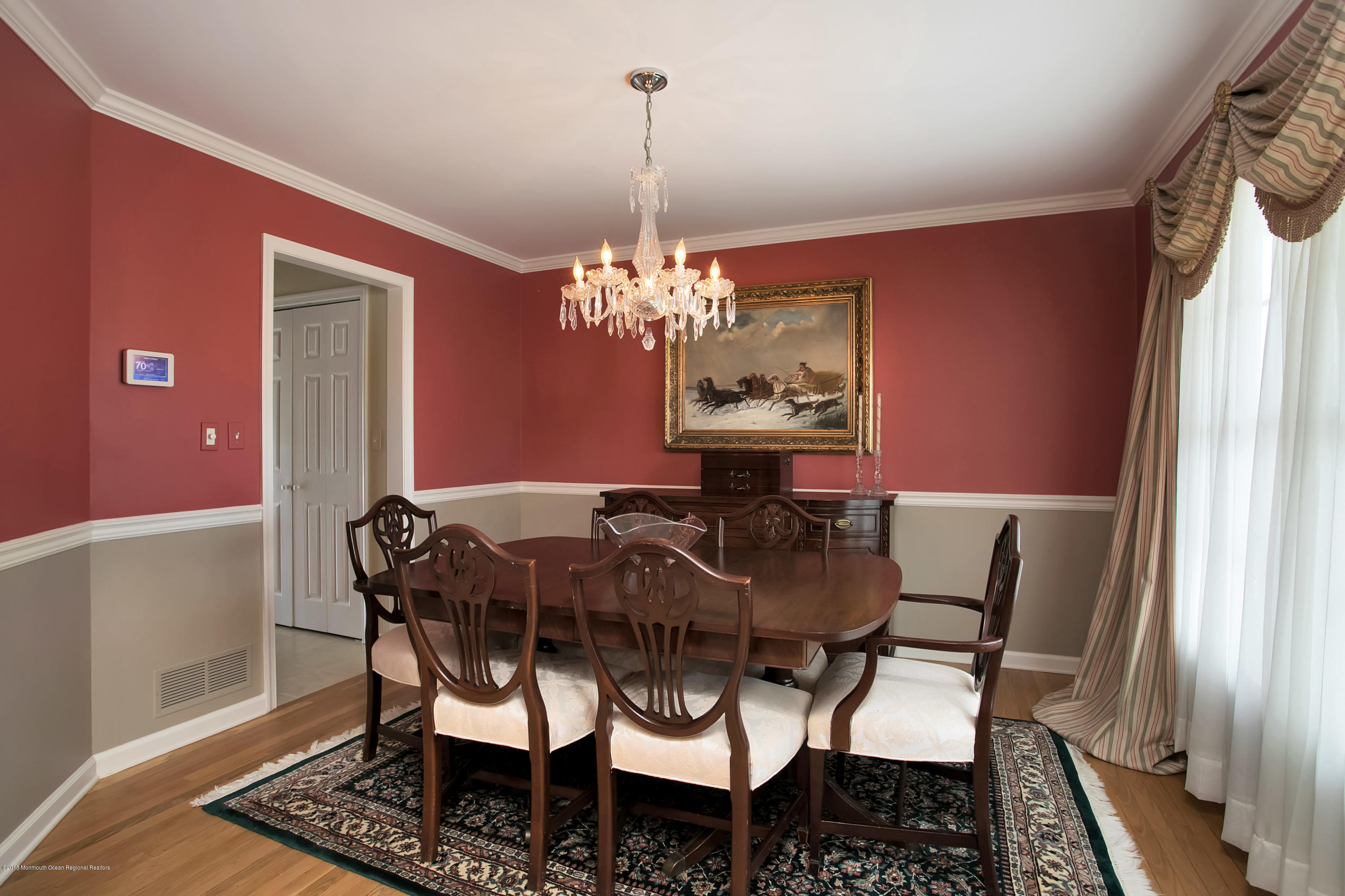 94 Ave Of Two Rivers Rumson, NJ 07760 - Photo 13 of 41 a view of a dining room with furniture and chandelier