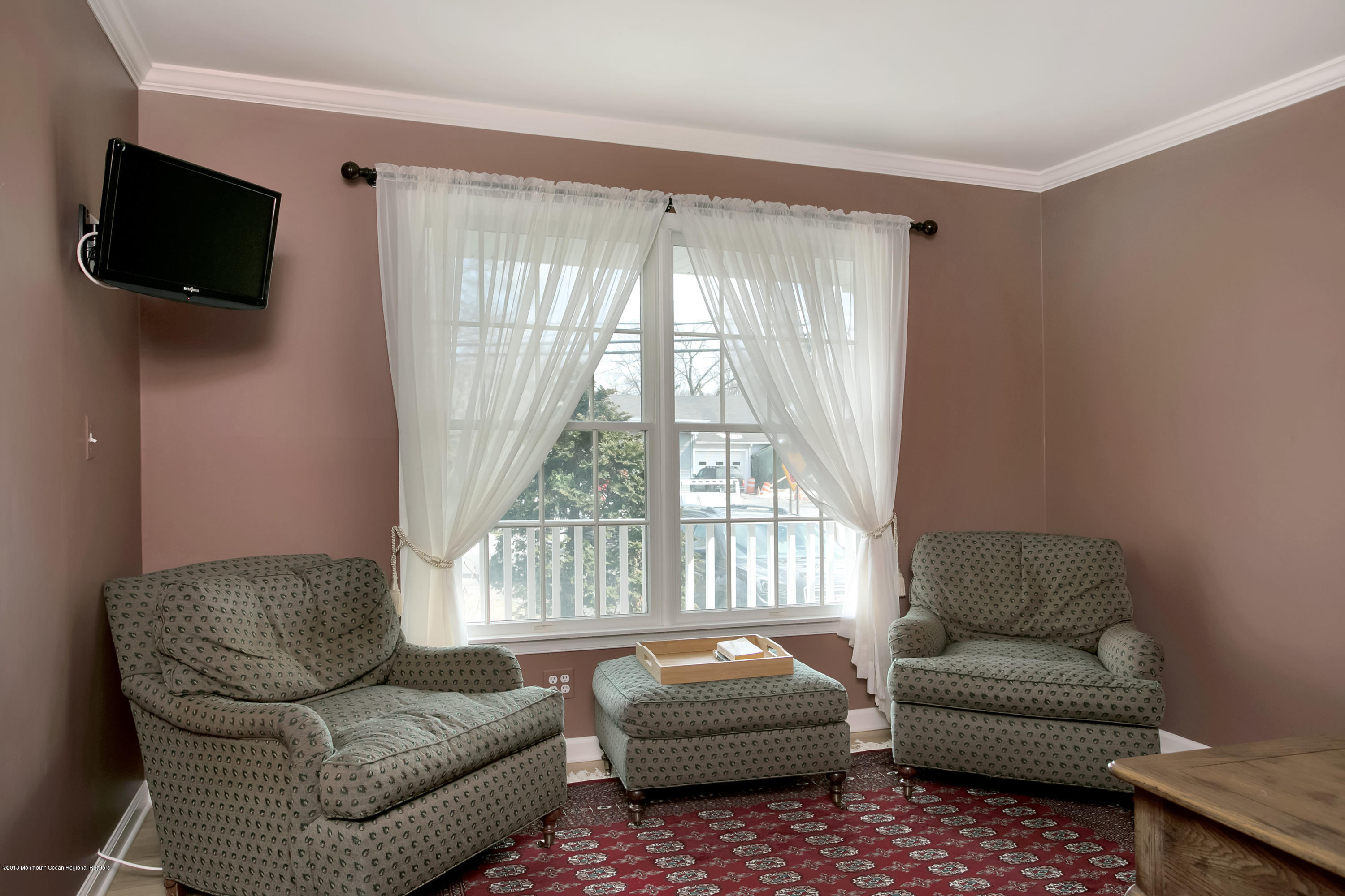 94 Ave Of Two Rivers Rumson, NJ 07760 - Photo 15 of 41 a living room with furniture a flat screen tv and a window