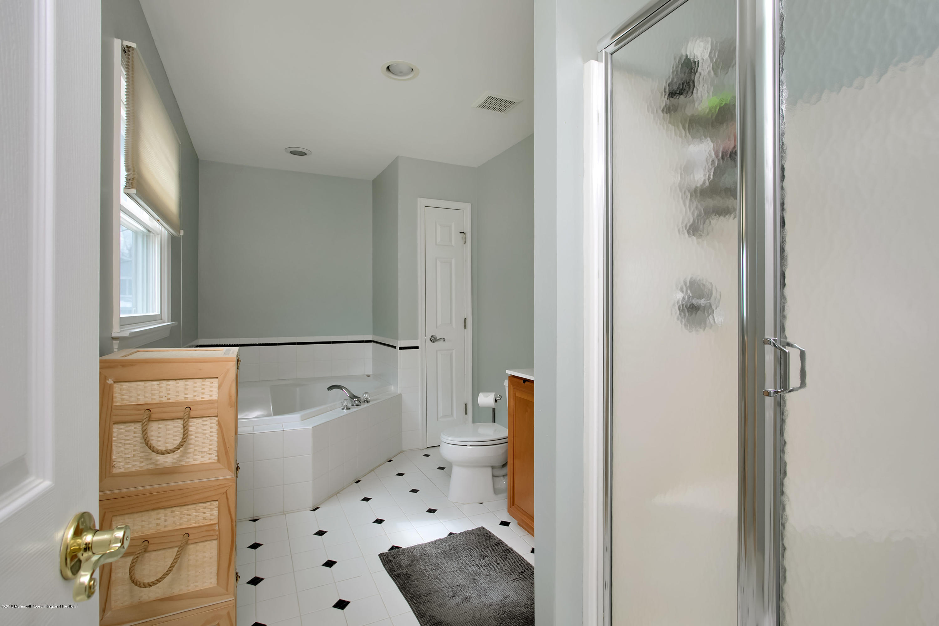 94 Ave Of Two Rivers Rumson, NJ 07760 - Photo 22 of 41 a bathroom with a bathtub and shower