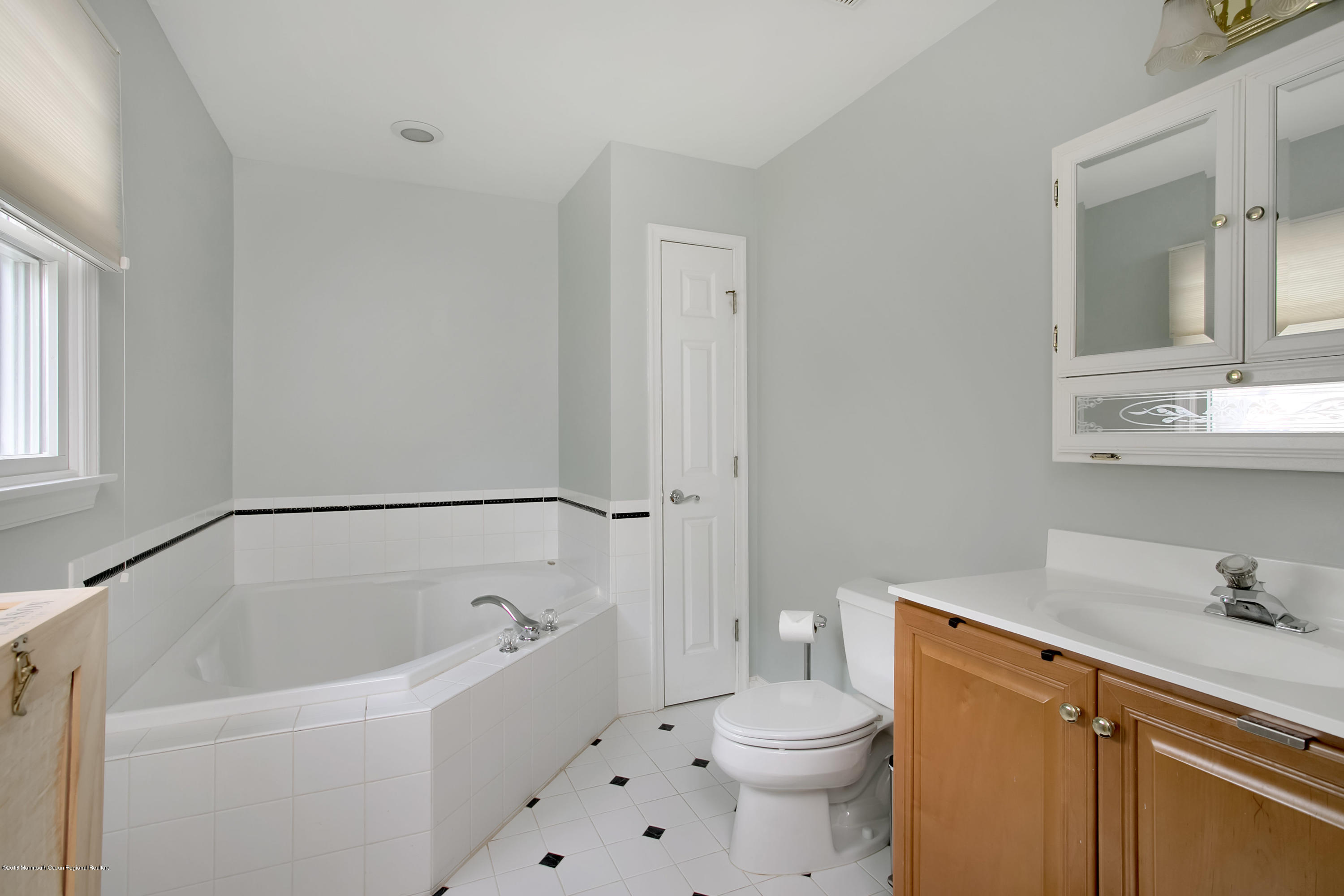94 Ave Of Two Rivers Rumson, NJ 07760 - Photo 23 of 41 a bathroom with a sink a toilet and a bathtub