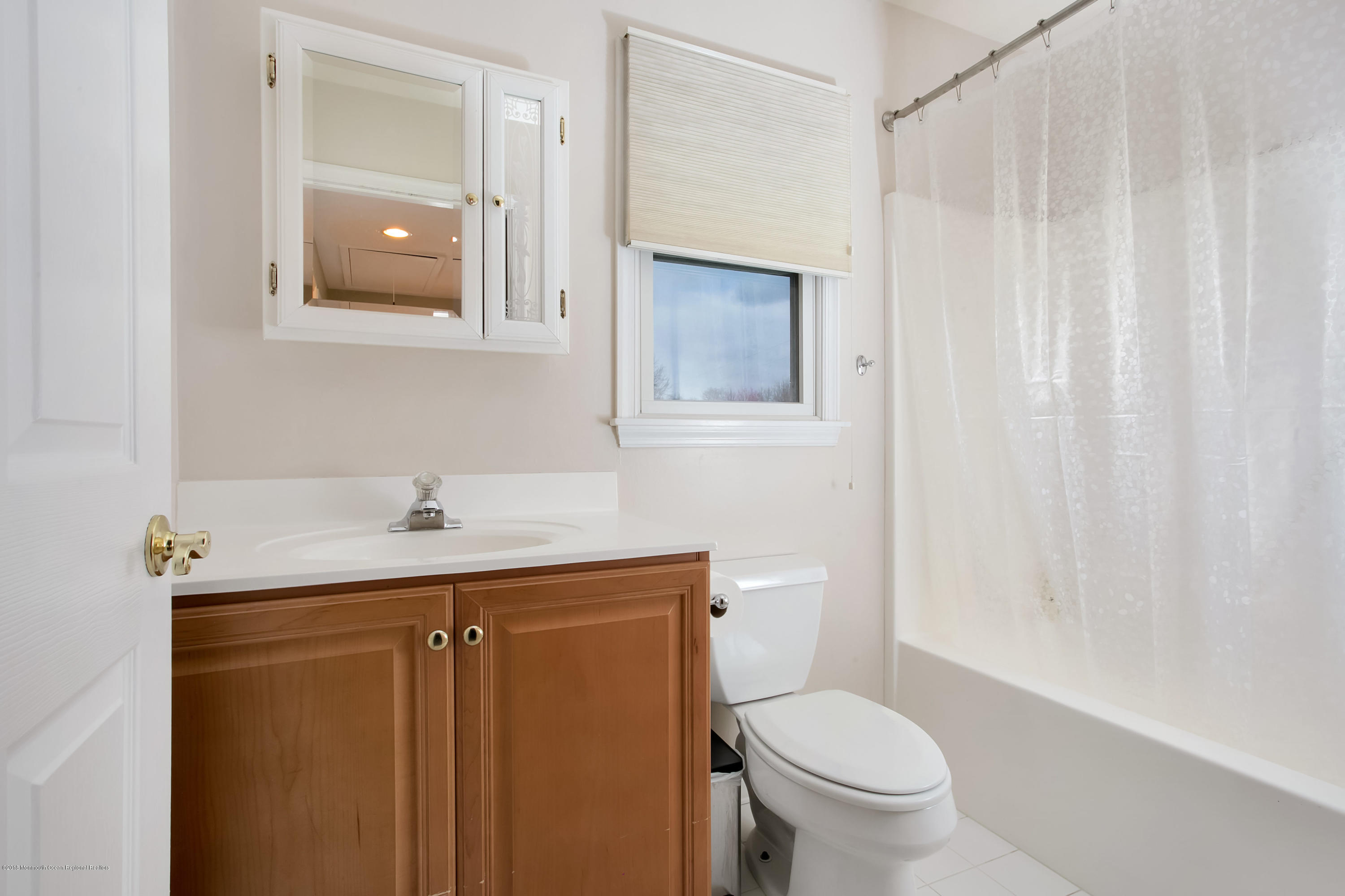 94 Ave Of Two Rivers Rumson, NJ 07760 - Photo 27 of 41 a bathroom with a granite countertop sink toilet and a mirror