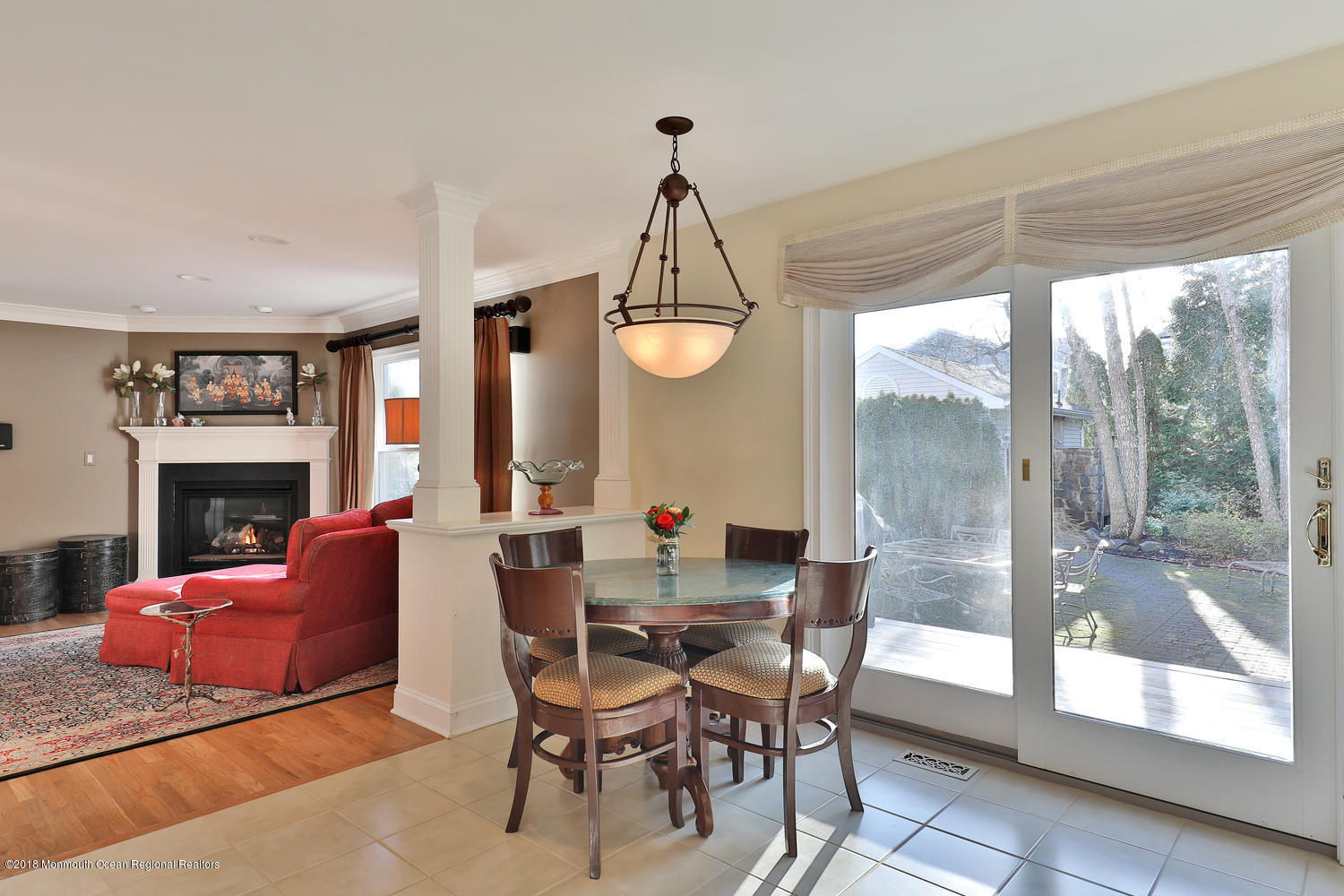 94 Ave Of Two Rivers Rumson, NJ 07760 - Photo 8 of 41 a dining room with furniture a fireplace and a chandelier
