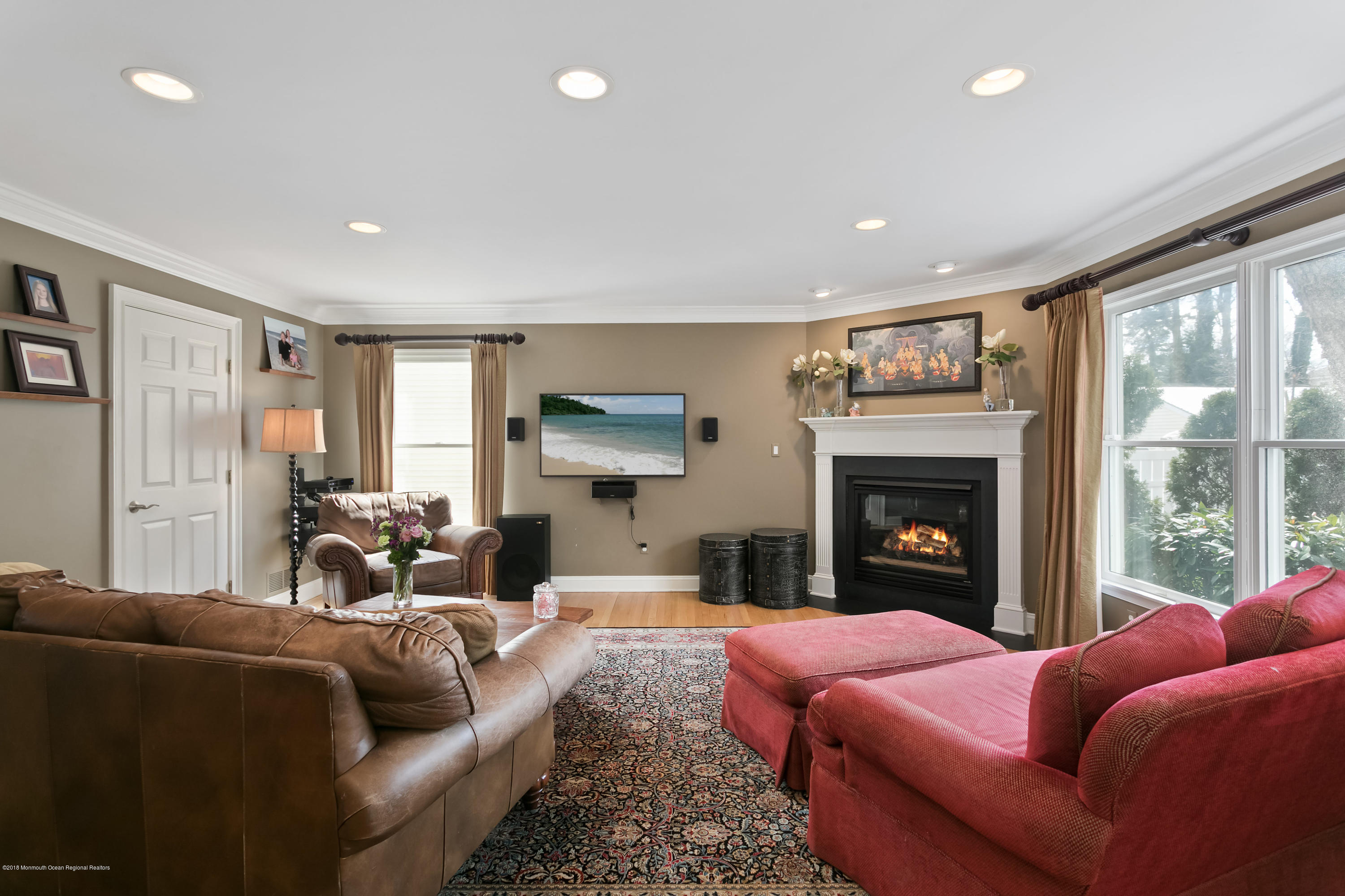 94 Ave Of Two Rivers Rumson, NJ 07760 - Photo 10 of 41 a living room with furniture a fireplace and a large window