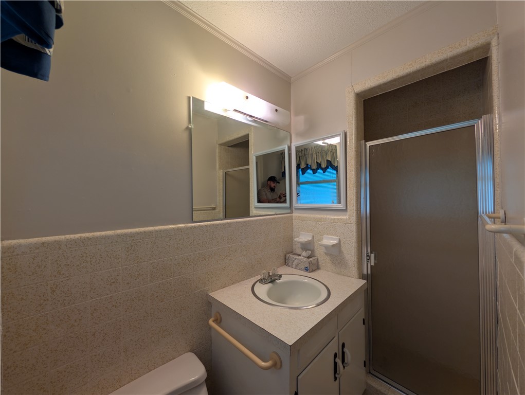 1000 Hickory Lane Anderson, SC 29624 - Photo 19 of 37 This functional bathroom features a shower and vanity with integrated sink, offering practicality and ease.