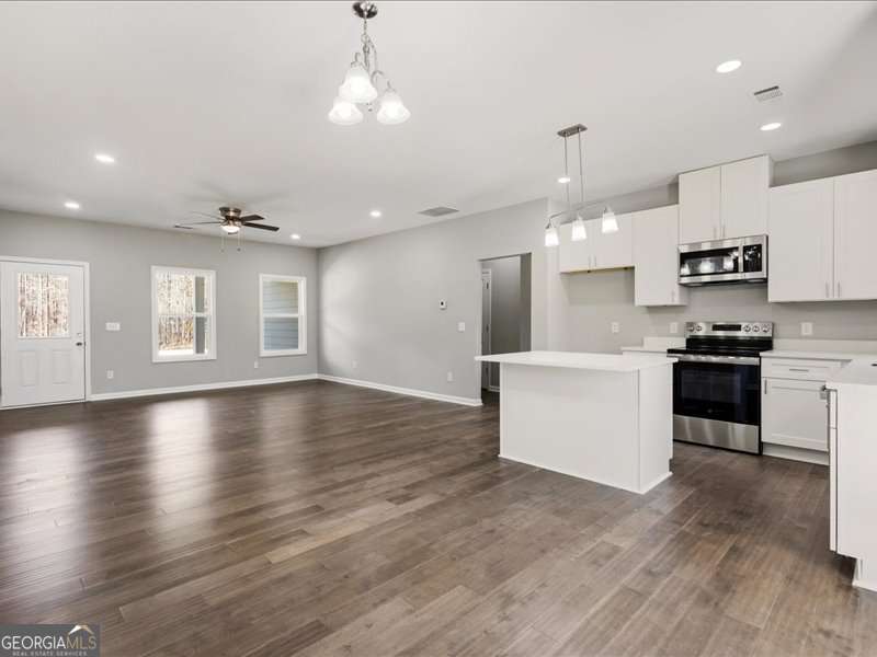1495 Kansas Jake Road Waco, GA 30182 - Photo 11 of 34 a view of kitchen with sink microwave and stove top oven