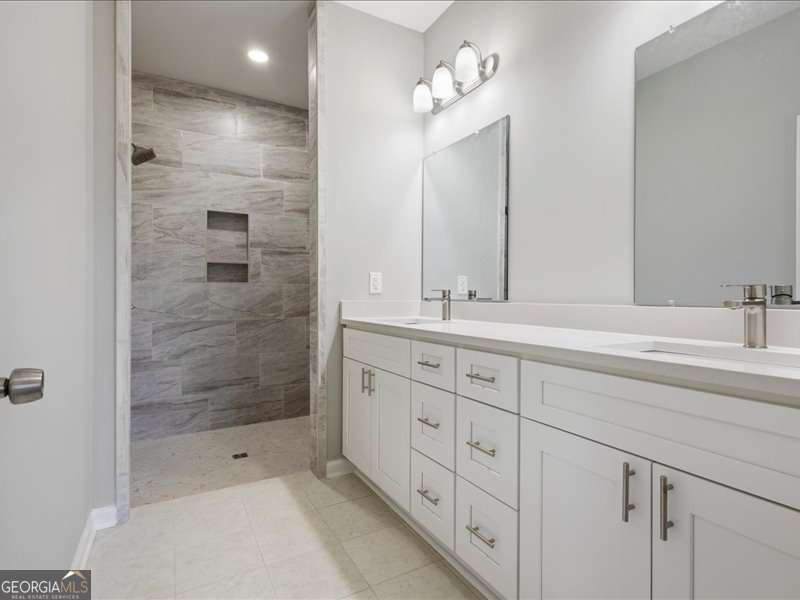 1495 Kansas Jake Road Waco, GA 30182 - Photo 15 of 34 a bathroom with double sink and a shower