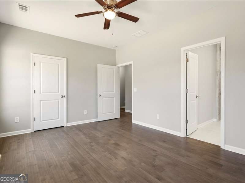 1495 Kansas Jake Road Waco, GA 30182 - Photo 16 of 34 a view of an empty room with wooden floor