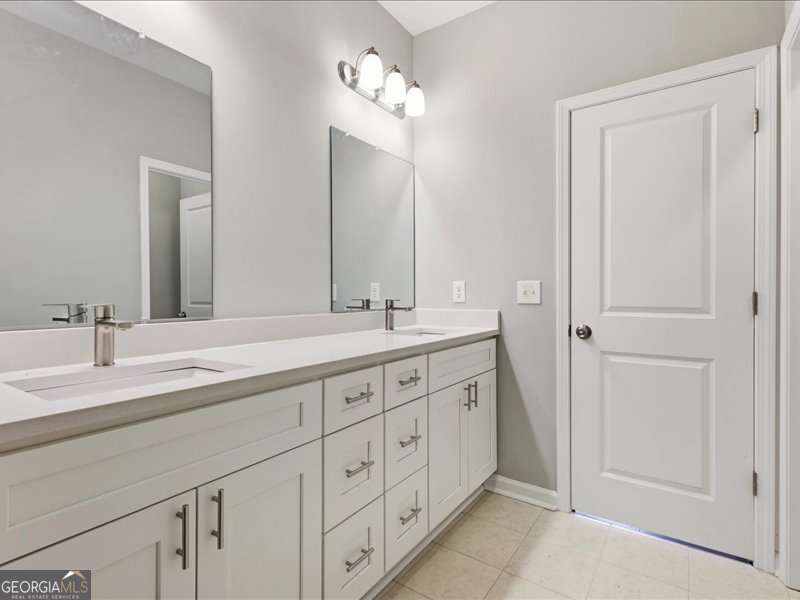 1495 Kansas Jake Road Waco, GA 30182 - Photo 18 of 34 a spacious bathroom with double sink and a mirror