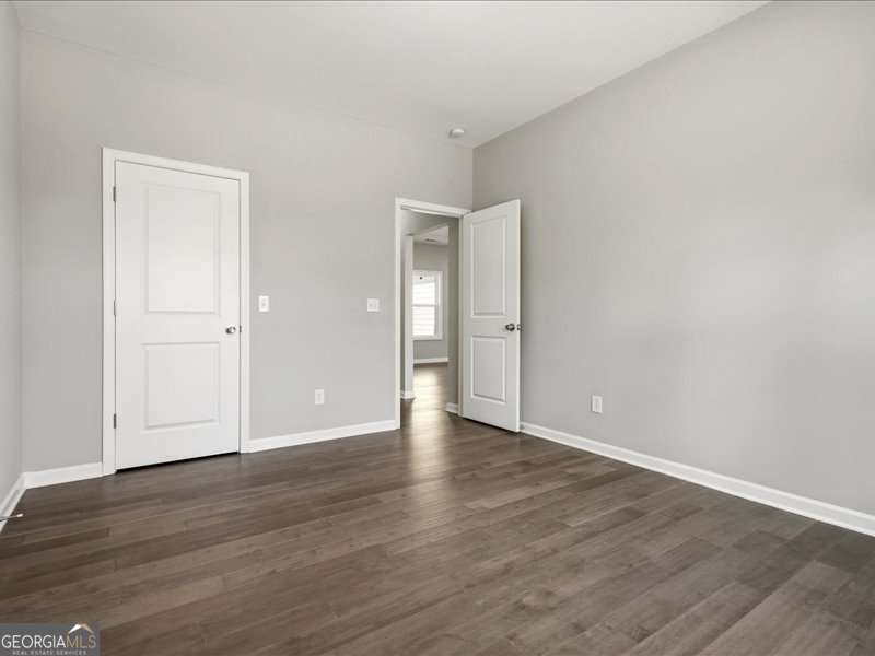 1495 Kansas Jake Road Waco, GA 30182 - Photo 24 of 34 a view of an empty room and wooden floor