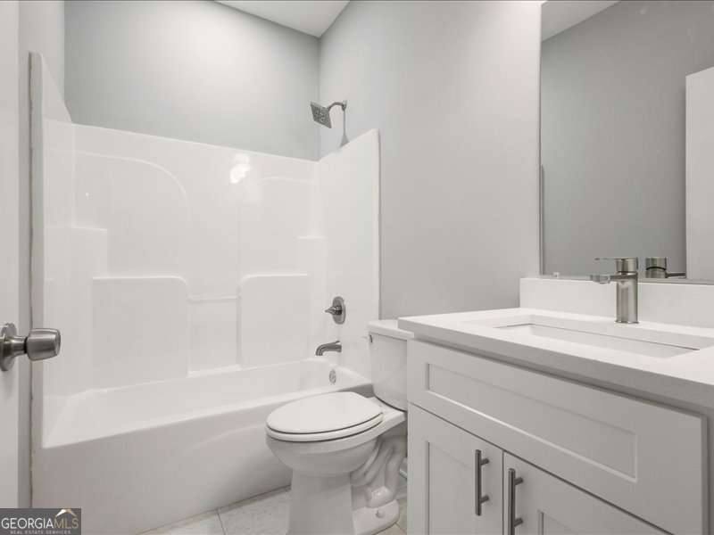 1495 Kansas Jake Road Waco, GA 30182 - Photo 25 of 34 a bathroom with a sink a toilet and a bathtub