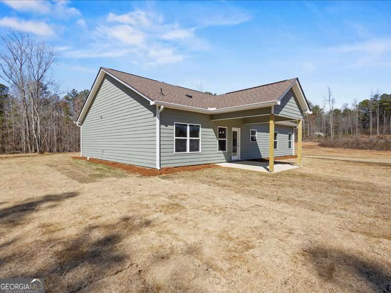 1495 Kansas Jake Road Waco, GA 30182 - Photo 29 of 34 a view of a house with backyard and trees