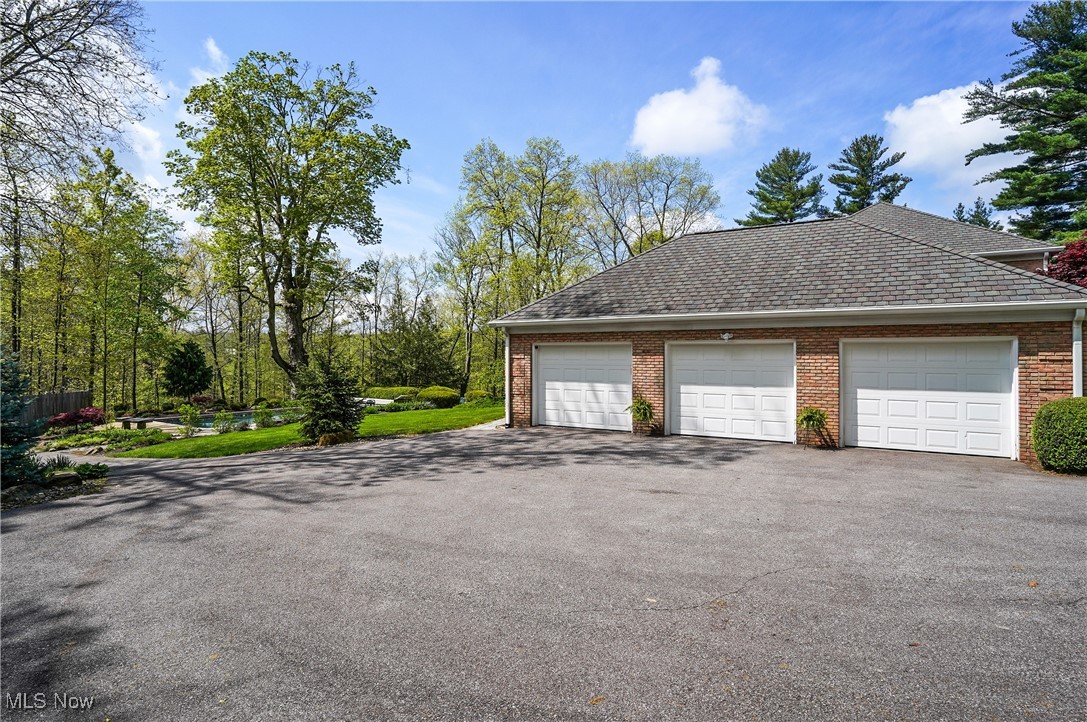 4432 Ira Road Akron, OH 44333 - Photo 43 of 50 Garage featuring asphalt driveway and fence