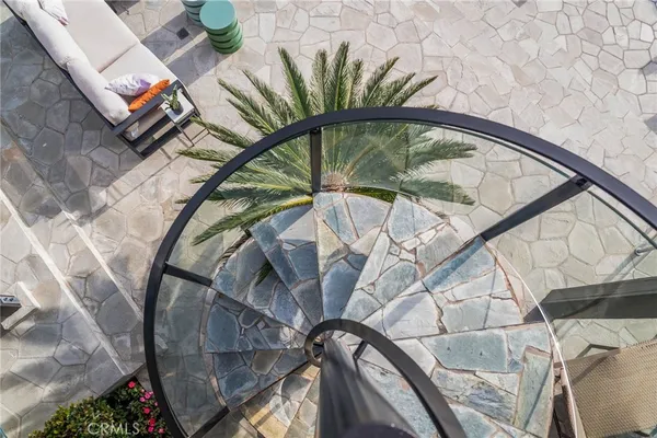a view of staircase with a rug