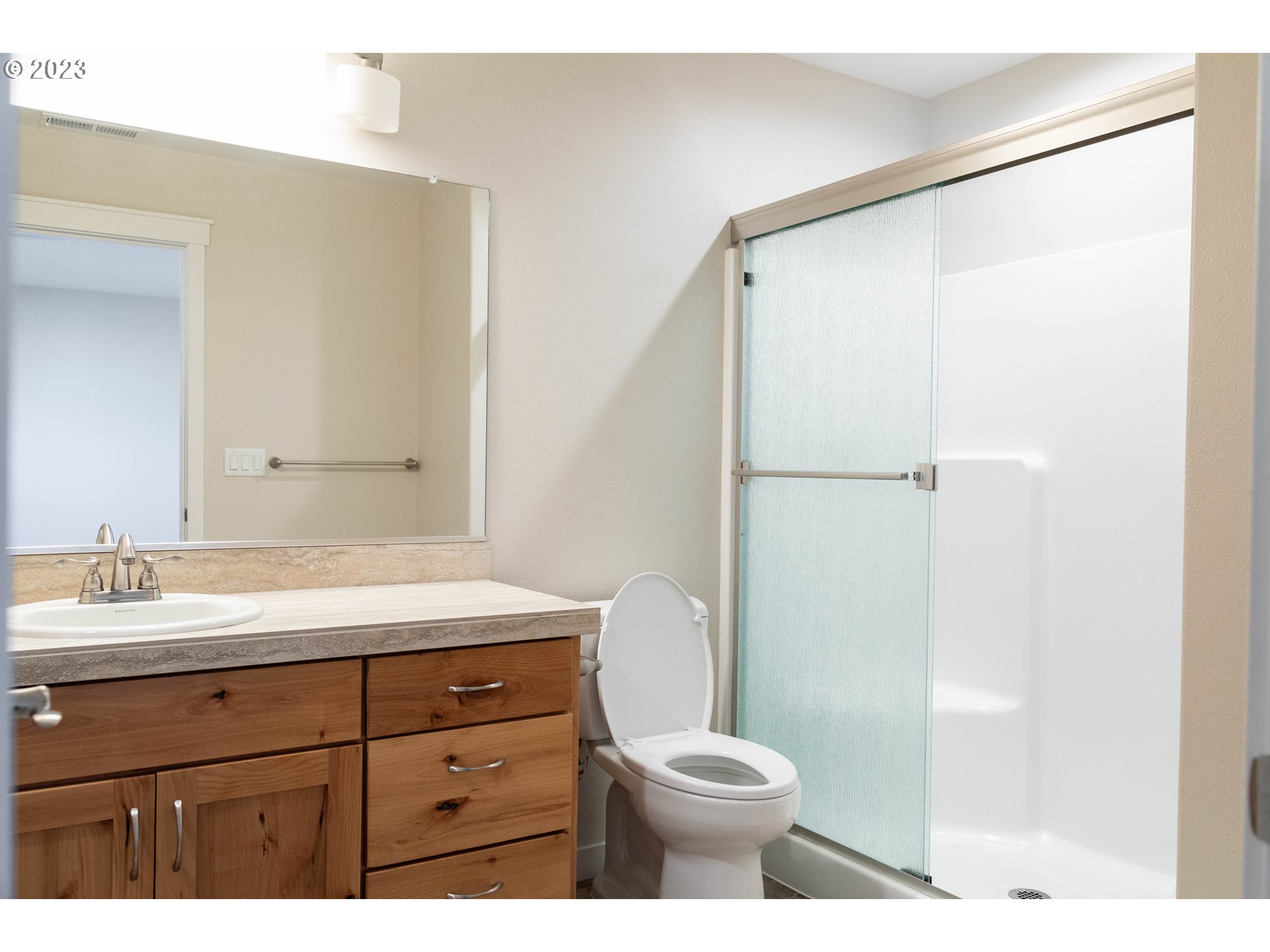 769 Southeast Meadows Loop Sheridan, OR 97378 - Photo 11 of 20 a bathroom with a granite countertop sink toilet and shower