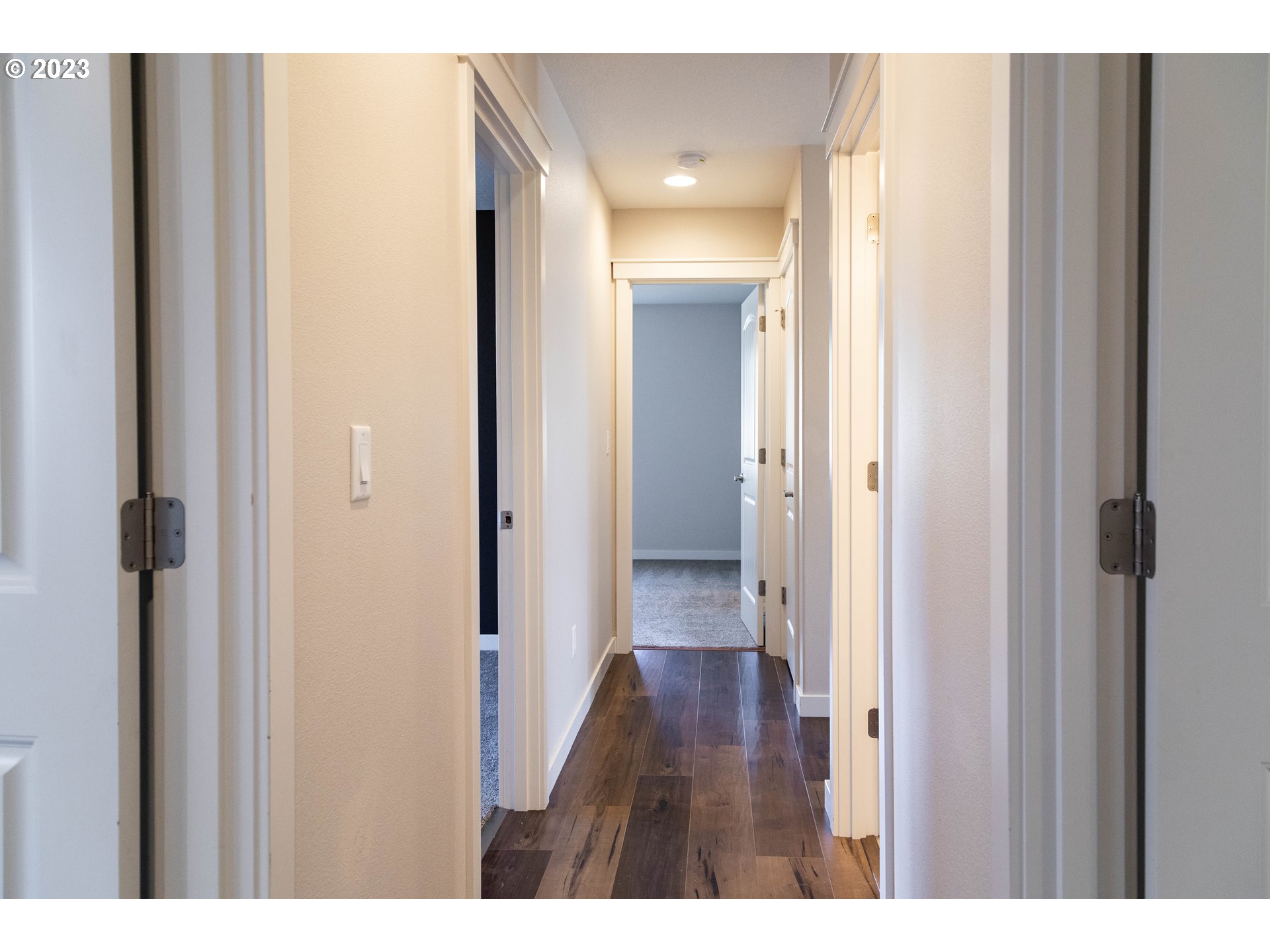 769 Southeast Meadows Loop Sheridan, OR 97378 - Photo 8 of 20 a view of a hallway with wooden floor
