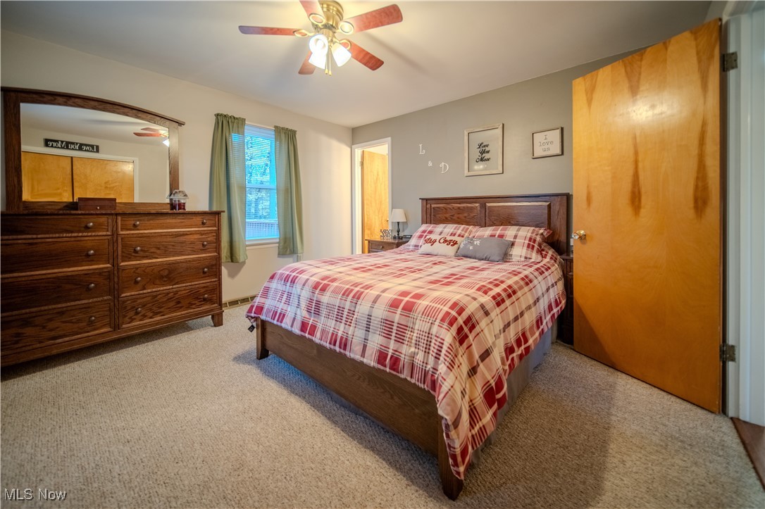 3447 Marian Road Ravenna, OH 44266 - Photo 18 of 35 Carpeted bedroom featuring a ceiling fan