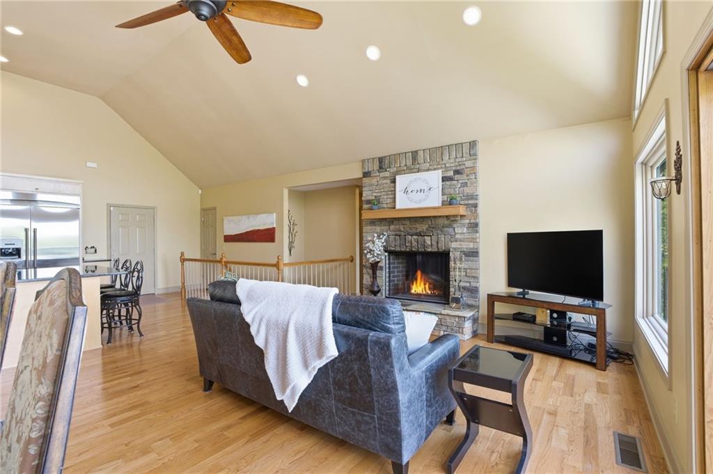 3326 Monument Road Jasper, GA 30143 - Photo 22 of 49 a living room with furniture a fireplace and a flat screen tv