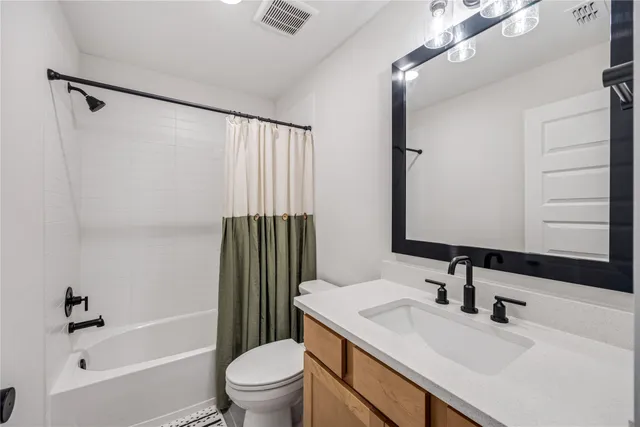 a bedroom with a bed and large window