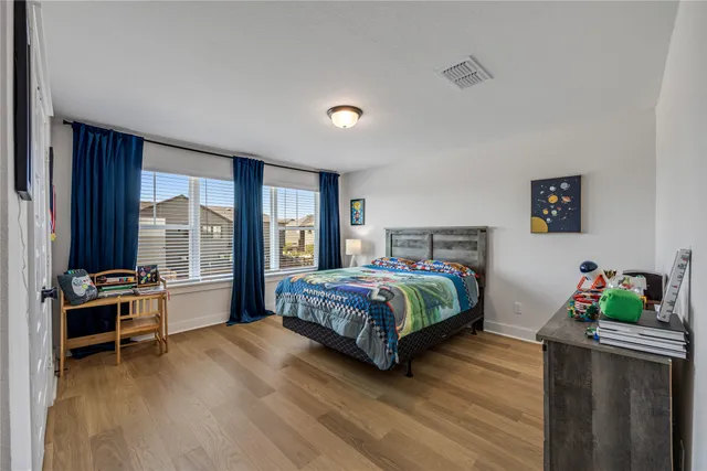 a view of yard with swimming pool and green space