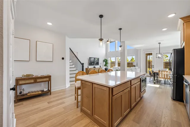 a kitchen with sink and refrigerator