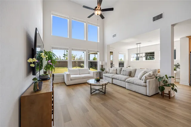 a living room with furniture fireplace and a flat screen tv