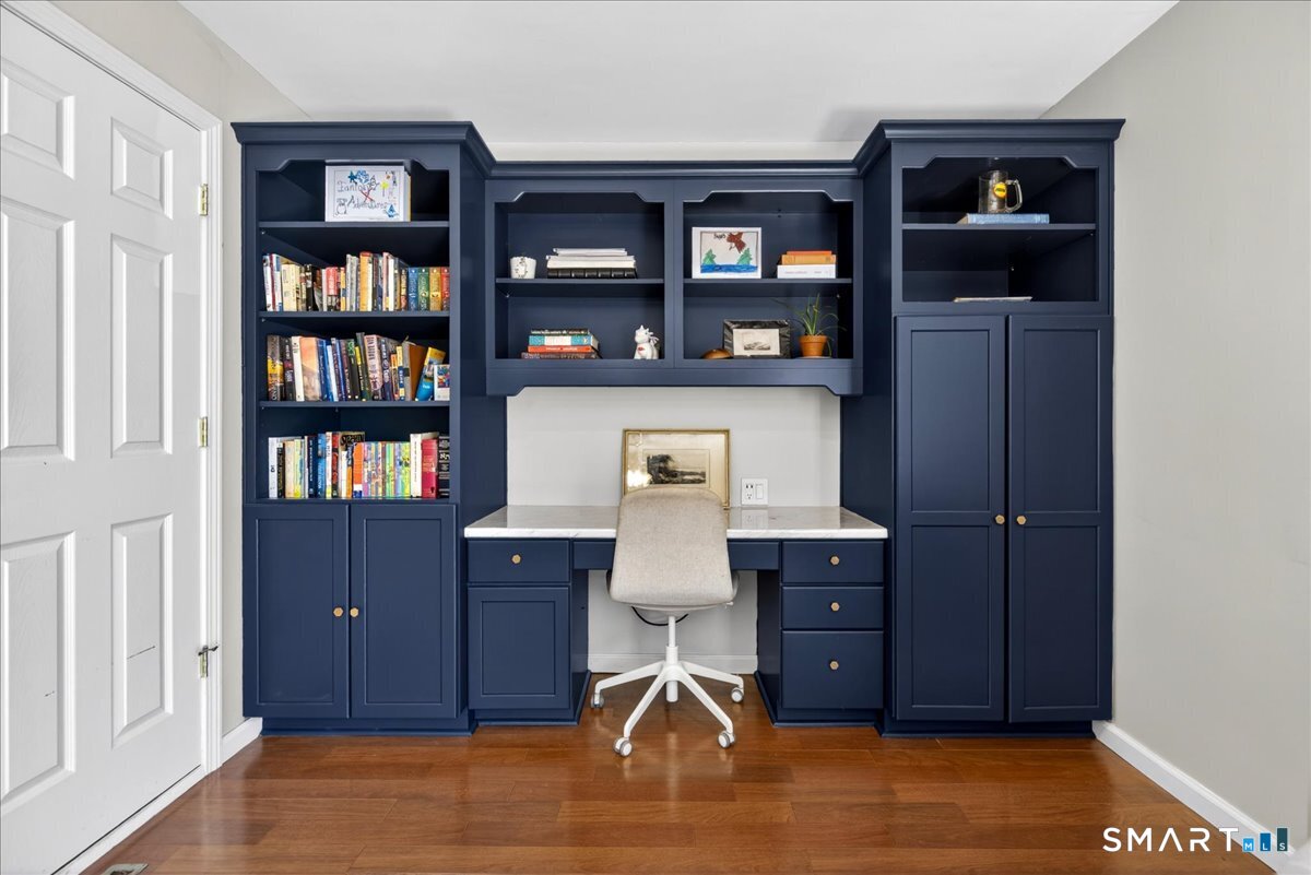144 Mather Street Hamden, CT 06517 - Photo 14 of 40 a room with cabinets and book shelf