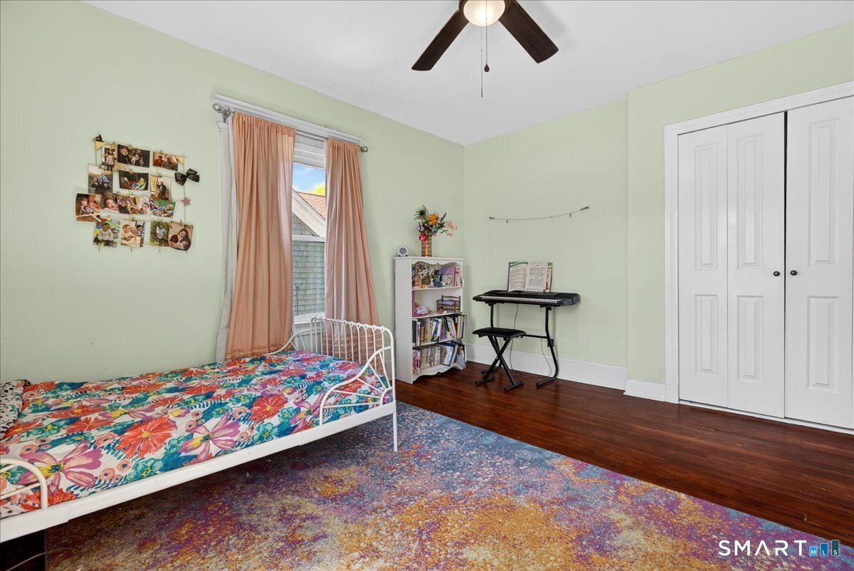 144 Mather Street Hamden, CT 06517 - Photo 19 of 40 a bedroom with a bed and a window