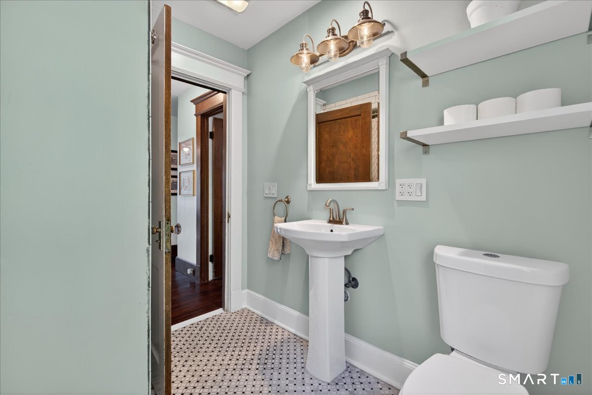 144 Mather Street Hamden, CT 06517 - Photo 22 of 40 a bathroom with a sink toilet and shower