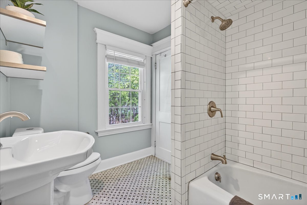 144 Mather Street Hamden, CT 06517 - Photo 23 of 40 a bathroom with a sink a toilet and shower