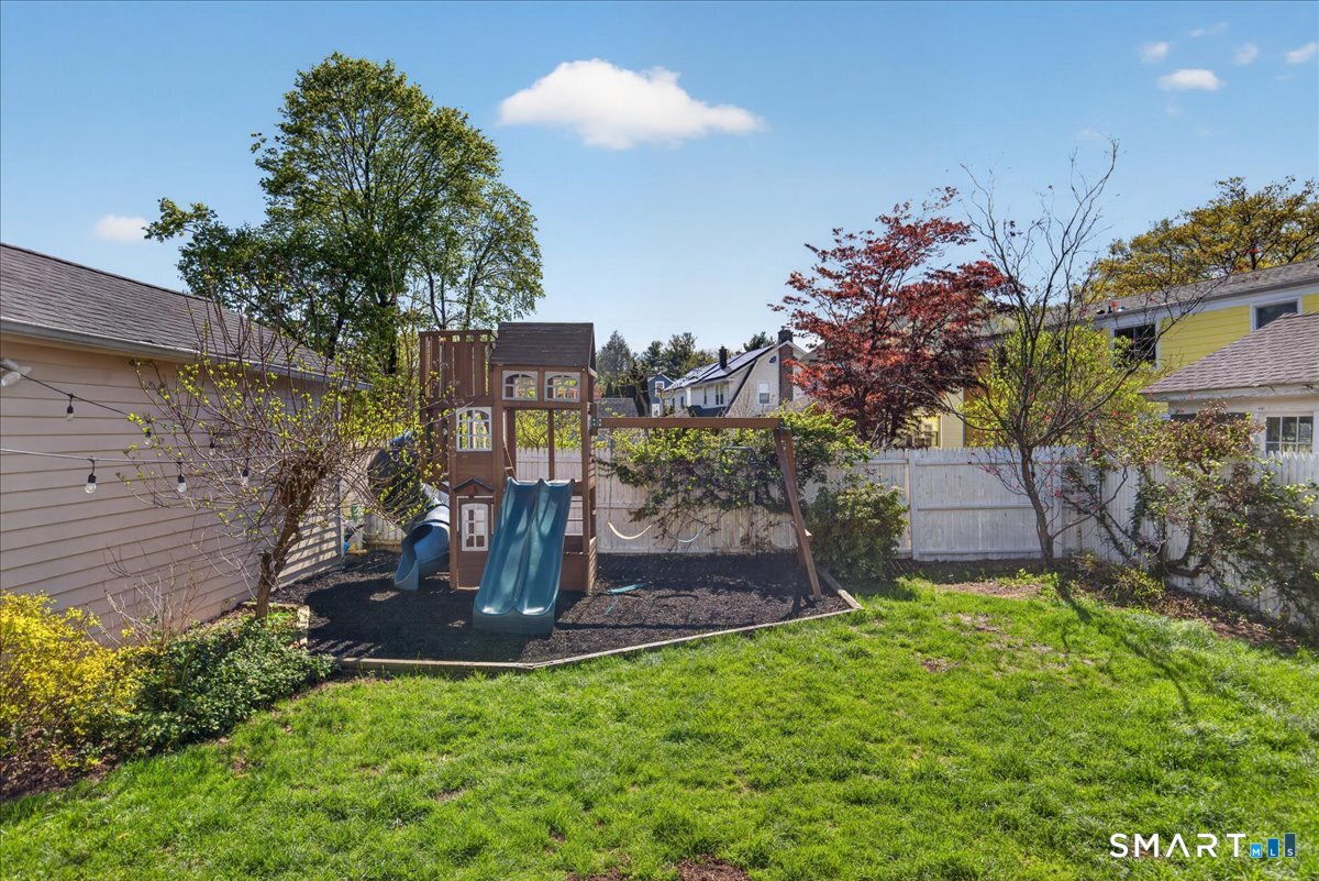 144 Mather Street Hamden, CT 06517 - Photo 30 of 40 a view of a chairs and table in backyard