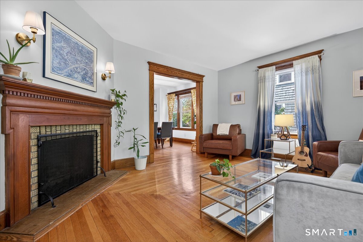 144 Mather Street Hamden, CT 06517 - Photo 5 of 40 a living room with furniture and a fireplace