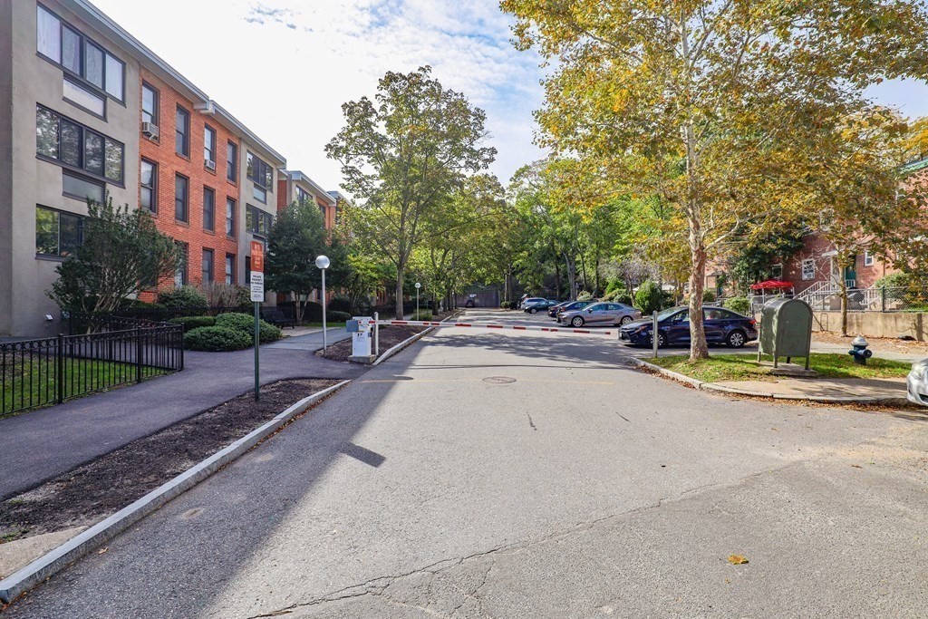32 Juniper Street, Unit 98 Brookline, MA 02445 - Photo 17 of 17 a view of a street with houses on both side of the road