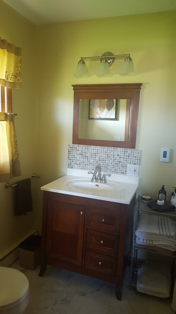 2502 Tower Road West Brooklyn, IL 61378 - Photo 11 of 26 a bathroom with a sink and a mirror