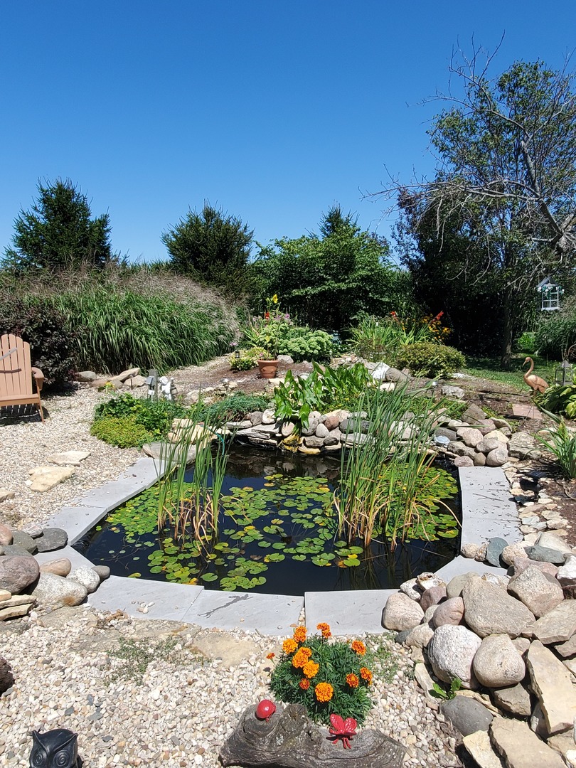 2502 Tower Road West Brooklyn, IL 61378 - Photo 22 of 26 a view of a bunch of flowers and trees in a garden