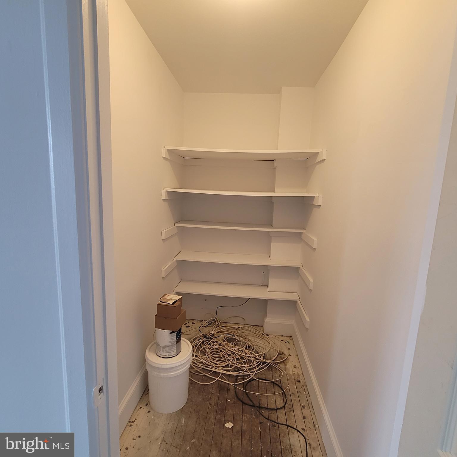 1673 Park Road Northwest, Unit 502 Washington, DC 20010 - Photo 11 of 23 a walk in closet with wooden floor