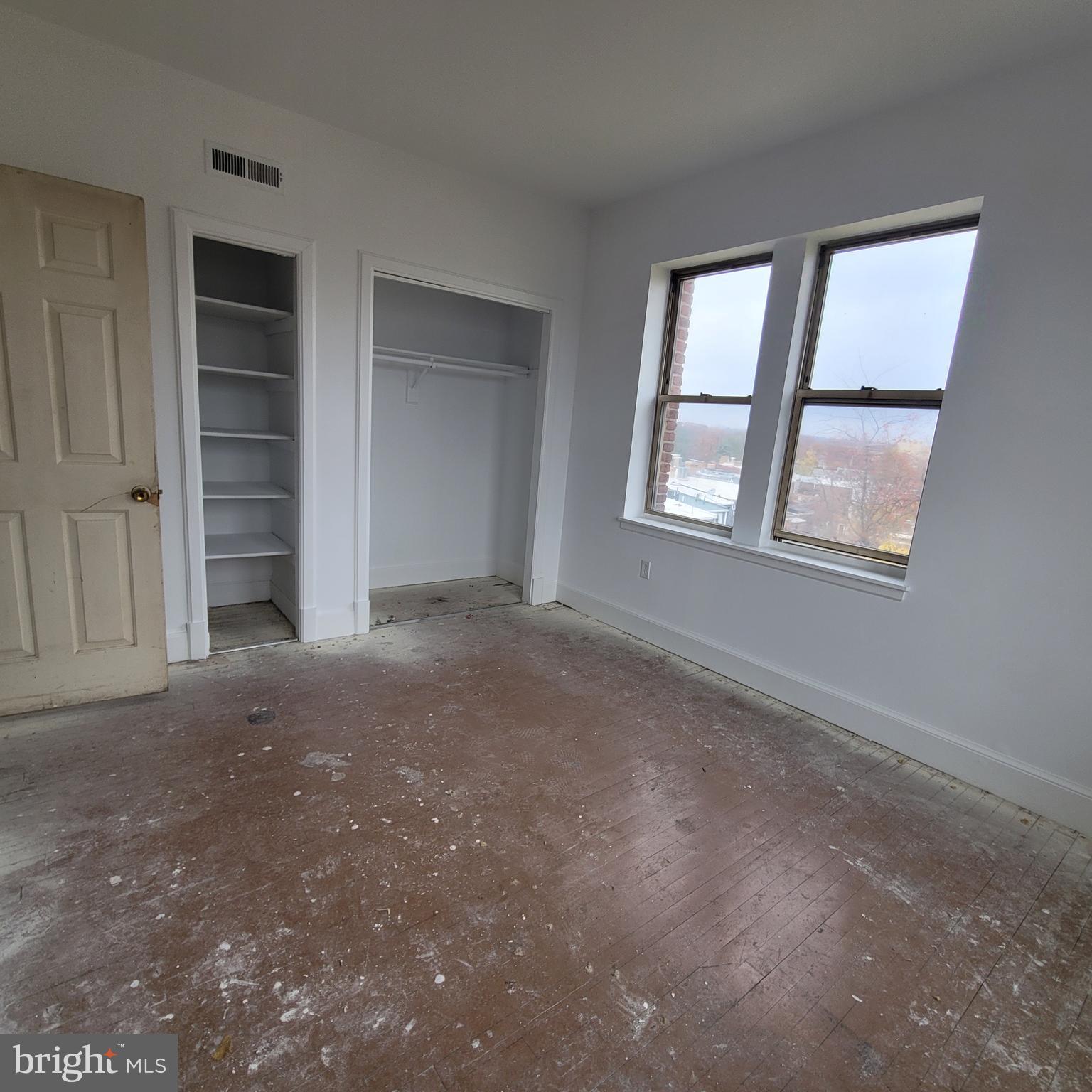 1673 Park Road Northwest, Unit 502 Washington, DC 20010 - Photo 7 of 23 an empty room with a window and closet